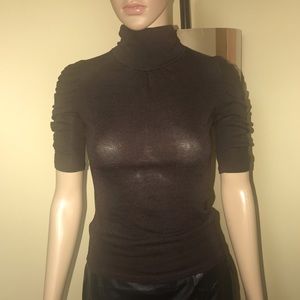 Brown mock neck top.